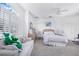 Well-lit bedroom featuring a ceiling fan, large windows, and neutral decor at 3374 Waterlute Way, Lakeland, FL 33811