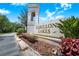 Elegant community sign with a bell tower, lush landscaping, and clearly displayed name for easy identification at 3374 Waterlute Way, Lakeland, FL 33811