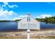 Community sign for Lake Sonata by a lake at 3374 Waterlute Way, Lakeland, FL 33811