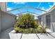 Private outdoor courtyard with an array of tropical plants, offering a serene and secluded retreat at 3374 Waterlute Way, Lakeland, FL 33811