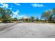 Community entrance featuring a roundabout with landscaping, offering a welcoming entry to the neighborhood at 3374 Waterlute Way, Lakeland, FL 33811