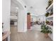 Open-concept space with tiled flooring, leading to kitchen and a living room at 3374 Waterlute Way, Lakeland, FL 33811