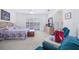 A bright Primary bedroom with carpet, shuttered windows, a ceiling fan, and an ensuite bathroom at 3374 Waterlute Way, Lakeland, FL 33811