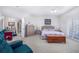 A spacious main bedroom features a bed with floral bedding, a ceiling fan, and shuttered windows for natural light at 3374 Waterlute Way, Lakeland, FL 33811
