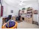 Bright office space with built in shelving, neutral carpet, and white walls at 3374 Waterlute Way, Lakeland, FL 33811