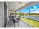 Screened in patio with ceiling fans overlooking a lake at 3374 Waterlute Way, Lakeland, FL 33811