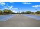 Wide angle shot of the community tennis courts for residents to enjoy at 3374 Waterlute Way, Lakeland, FL 33811