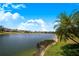 Beautiful water view with lush green grass that adds a feeling of openness and tranquility at 3374 Waterlute Way, Lakeland, FL 33811