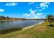 Beautiful water view with lush green grass that adds a feeling of openness and tranquility at 3374 Waterlute Way, Lakeland, FL 33811