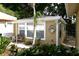 Well-manicured backyard featuring a patio, furniture, and lush landscaping at 418 E 10Th Ave, Mount Dora, FL 32757