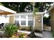 Well-manicured backyard featuring a patio, furniture, and lush landscaping at 418 E 10Th Ave, Mount Dora, FL 32757