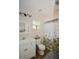 Cozy bathroom includes floral shower curtain, neutral paint, and a modern sink with vanity at 418 E 10Th Ave, Mount Dora, FL 32757