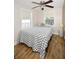 Comfortable bedroom with two windows allowing natural light to brighten the room at 418 E 10Th Ave, Mount Dora, FL 32757