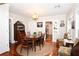 Elegant dining room featuring a chandelier, hardwood floors, and a dining table for six at 418 E 10Th Ave, Mount Dora, FL 32757
