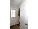 Mudroom featuring white door with window panels, sink, storage, and light-colored walls at 418 E 10Th Ave, Mount Dora, FL 32757