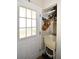 Mudroom featuring white door with window panels, sink, storage, and light-colored walls at 418 E 10Th Ave, Mount Dora, FL 32757