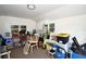 Interior view of the shed featuring storage shelves, tools, and natural light from the windows at 418 E 10Th Ave, Mount Dora, FL 32757