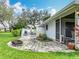 View from the living area, looking out onto the outdoor dining and grill area of the home at 42 Grenewood Ln, Haines City, FL 33844