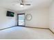 Spacious bedroom featuring a ceiling fan, TV, and a mirror for added convenience at 42 Grenewood Ln, Haines City, FL 33844