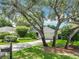 Charming one-story home with lush landscaping, mature trees, and a well-maintained front lawn at 42 Grenewood Ln, Haines City, FL 33844