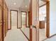 Hallway with wood cabinets and a mirrored wall for a modern look at 42 Grenewood Ln, Haines City, FL 33844