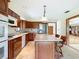 Open kitchen features lots of cabinets, large island, modern appliances and tile floors at 42 Grenewood Ln, Haines City, FL 33844