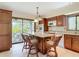 Spacious kitchen with an island, a window looking out to the yard, and an attached breakfast nook with patio view at 42 Grenewood Ln, Haines City, FL 33844