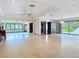 Expansive living room featuring tiled floors, a ceiling fan and access to a dining or sunroom at 42 Grenewood Ln, Haines City, FL 33844