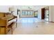 Spacious living room with tiled floors, recessed lights, a ceiling fan, and large windows at 42 Grenewood Ln, Haines City, FL 33844