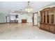 Open living space with a ceiling fan, tiled floors, and access to various living areas at 42 Grenewood Ln, Haines City, FL 33844