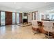 Open-concept living space with tiled floors, a bar area and seamless flow to the entry at 42 Grenewood Ln, Haines City, FL 33844