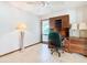 Bright home office with natural light, featuring built-in desk, cabinets, and shelving at 42 Grenewood Ln, Haines City, FL 33844