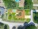 Aerial view of the home showcasing the solar panels, screened-in pool, and backyard at 4333 Shadow Wood Way, Winter Haven, FL 33880