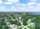 Breathtaking aerial shot of a neighborhood, showcasing lush greenery and a serene lake in the distance at 4333 Shadow Wood Way, Winter Haven, FL 33880