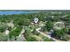 Nice aerial view of a residential area near a lake, featuring tree-lined streets and well-maintained homes at 4333 Shadow Wood Way, Winter Haven, FL 33880