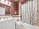 A bathroom featuring a toilet, bathtub, and vanity with sink at 4333 Shadow Wood Way, Winter Haven, FL 33880