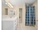 Bright bathroom features a large mirror and built in storage at 4333 Shadow Wood Way, Winter Haven, FL 33880