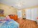 Bedroom with laminate floors, ceiling fan and closet at 4333 Shadow Wood Way, Winter Haven, FL 33880