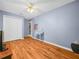This bedroom includes wood floors, and a closet with an adjacent door at 4333 Shadow Wood Way, Winter Haven, FL 33880