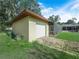 View of the detached garage from the yard at 4333 Shadow Wood Way, Winter Haven, FL 33880