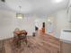 Eat-in kitchen features wood floors and access to other rooms, including the bathroom at 4333 Shadow Wood Way, Winter Haven, FL 33880