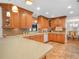 Spacious kitchen featuring custom cabinetry, a large countertop, and tile backsplash at 4333 Shadow Wood Way, Winter Haven, FL 33880