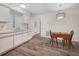 Eat-in kitchen features wood floors, bright lighting, and access to other rooms at 4333 Shadow Wood Way, Winter Haven, FL 33880