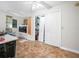 Bright laundry area with washer, dryer, overhead lighting, closet and decorative tile flooring at 4333 Shadow Wood Way, Winter Haven, FL 33880