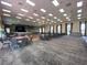 Spacious banquet hall featuring tables, chairs, and a stage perfect for large gatherings at 4480 Turnberry Ln, Lake Wales, FL 33859