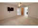 Spacious bedroom with neutral walls, carpet and access to ensuite bathroom and walk-in closet at 4480 Turnberry Ln, Lake Wales, FL 33859