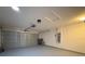 Spacious two-car garage featuring a neutral epoxy floor, providing a clean and functional space at 4480 Turnberry Ln, Lake Wales, FL 33859