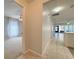 Bright hallway with tiled floor and open view to living room and a room with carpet at 4480 Turnberry Ln, Lake Wales, FL 33859