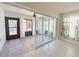 Versatile sun room with sliding glass doors, neutral flooring, and plenty of natural light at 4480 Turnberry Ln, Lake Wales, FL 33859