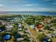 Aerial view of the home surrounded by trees in a quiet neighborhood near the lake at 4703 Benton St, Lake Wales, FL 33859